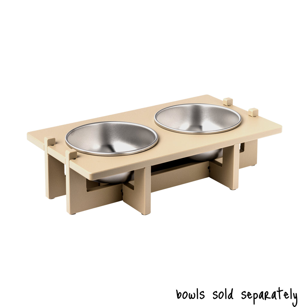 A double bowl Rise Pet Bowl Stand for medium dog bowls. Text reads "bowls sold separately".