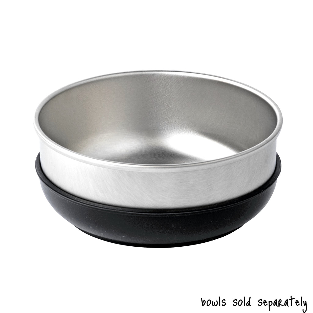 A single large size Basis Pet stainless steel dog bowl in a black colored bowl cozy. Text reads "bowls sold separately".