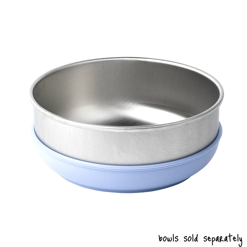 A single large size Basis Pet stainless steel dog bowl in a light blue colored bowl cozy. Text reads "bowls sold separately".