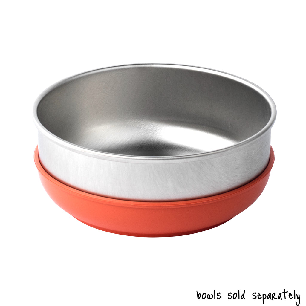 A single large size Basis Pet stainless steel dog bowl in a coral colored bowl cozy. Text reads "bowls sold separately".
