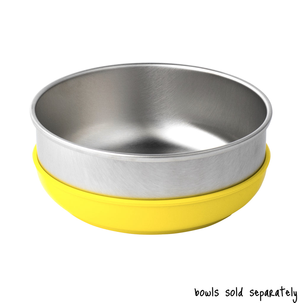 A single large size Basis Pet stainless steel dog bowl in a light yellow colored bowl cozy. Text reads "bowls sold separately".