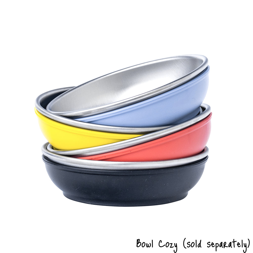A stack of 4 small size Basis Pet Stainless Steel Dog bowls, each in a different colored bowl cozy. Text reads "Bowl Cozy (sold separately)".